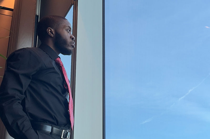 Student looking out a window