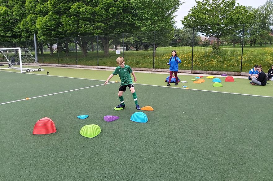 Child with sports cones