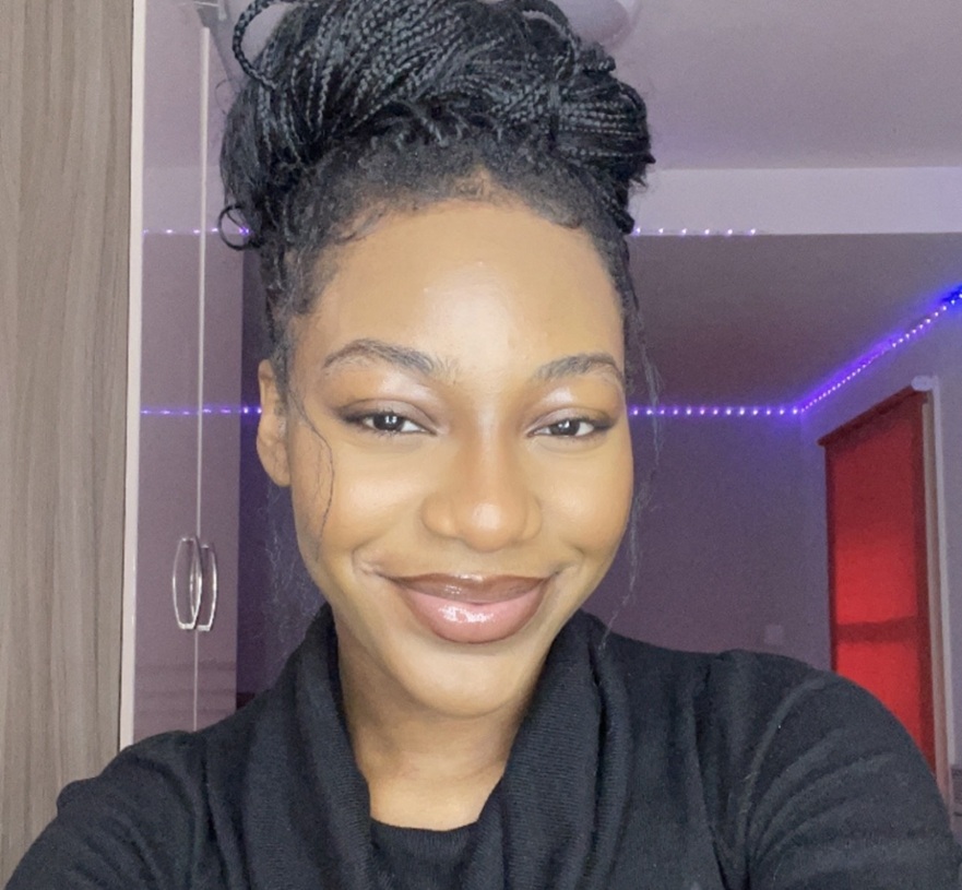 A person facing the camera, smiling.