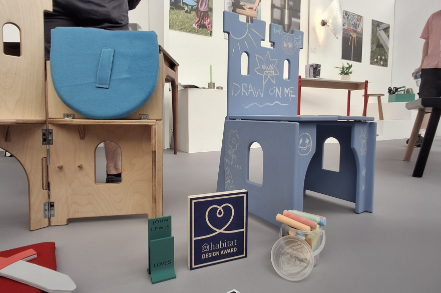 A wooden children's chair that can be converted into a play activity.