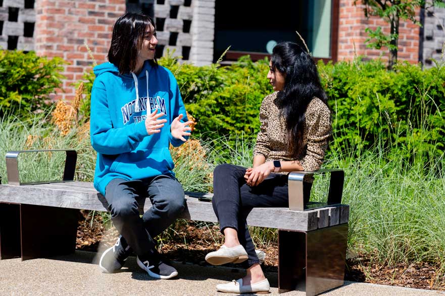 Students sitting on bench Clifton