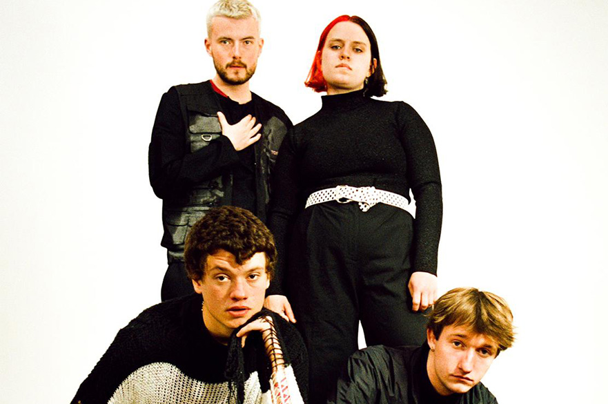 Four people in front of a white background