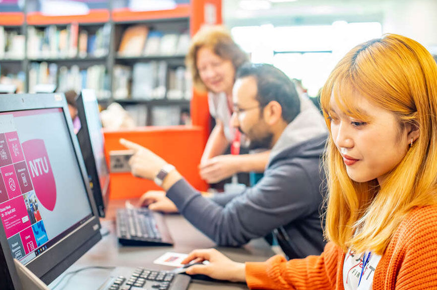 Student sitting in front of a computer screen