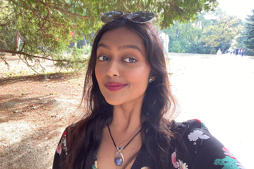 Komal smiling to the camera 