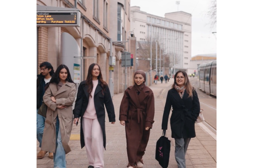 Aliyana walking with her friends outside NTU