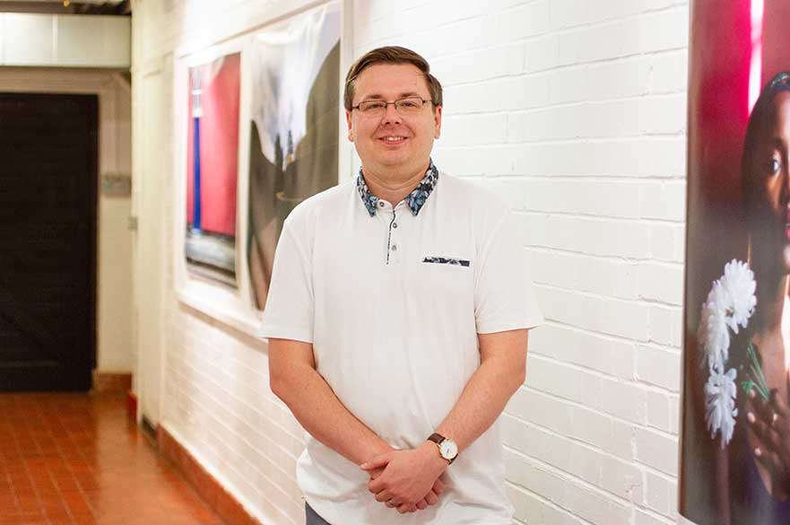 Adam Deakin in the Photography corridor