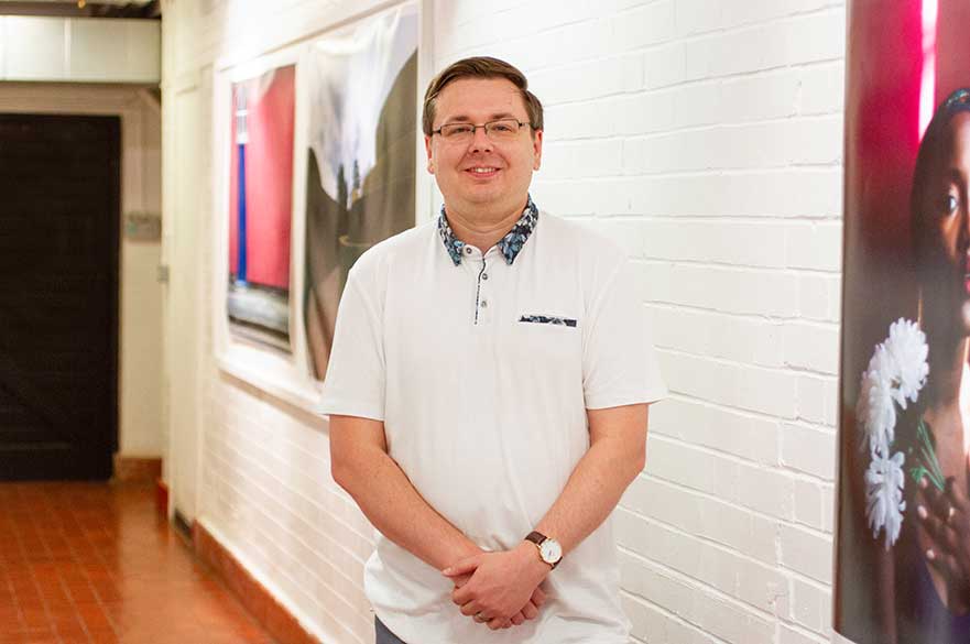 Adam Deakin  in the Photography corridor 