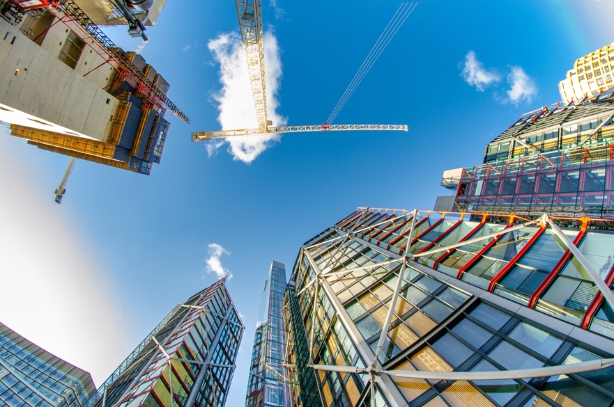 Shot taken from the base of high rise buildings looking up towards the sky