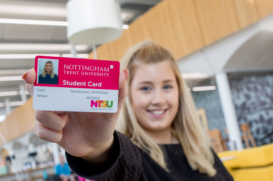 Female student holding student card