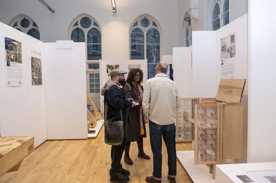 People talking at an exhibition.