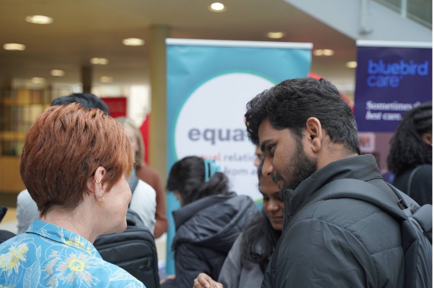 Two students seek advice at a careers fair