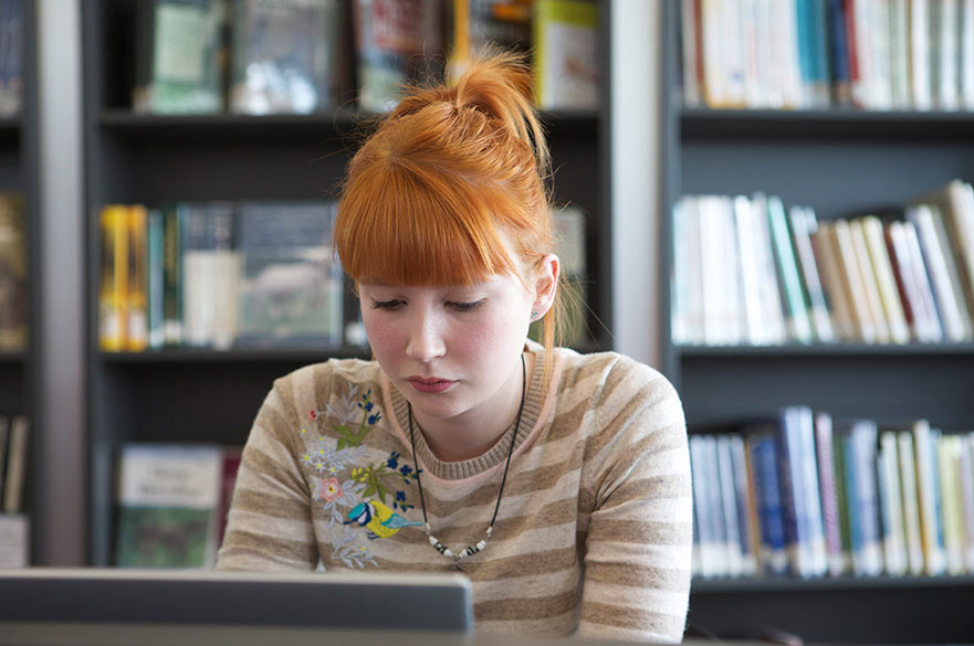 Student in library