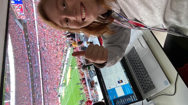 Nancy taking a selfie whilst working on her laptop during a football match