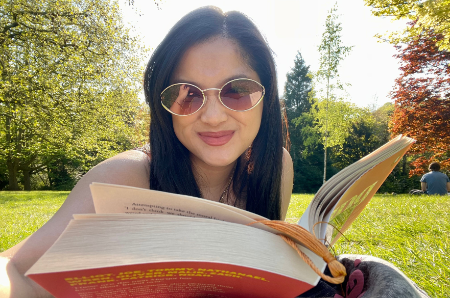 Reading a book at The Arboretum in Nottingham