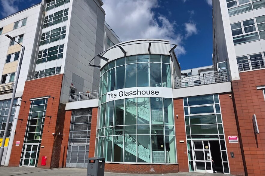 Outside the front of the Glasshouse.