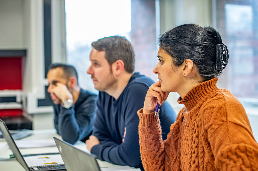 Corporate students working in a classroom