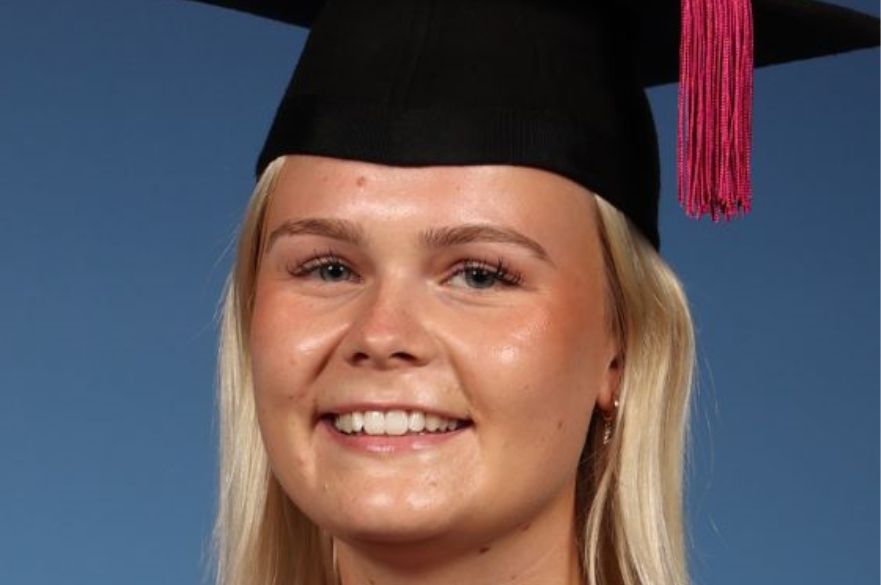 Headshot of Charlotte Jordan in graduation gown and cap