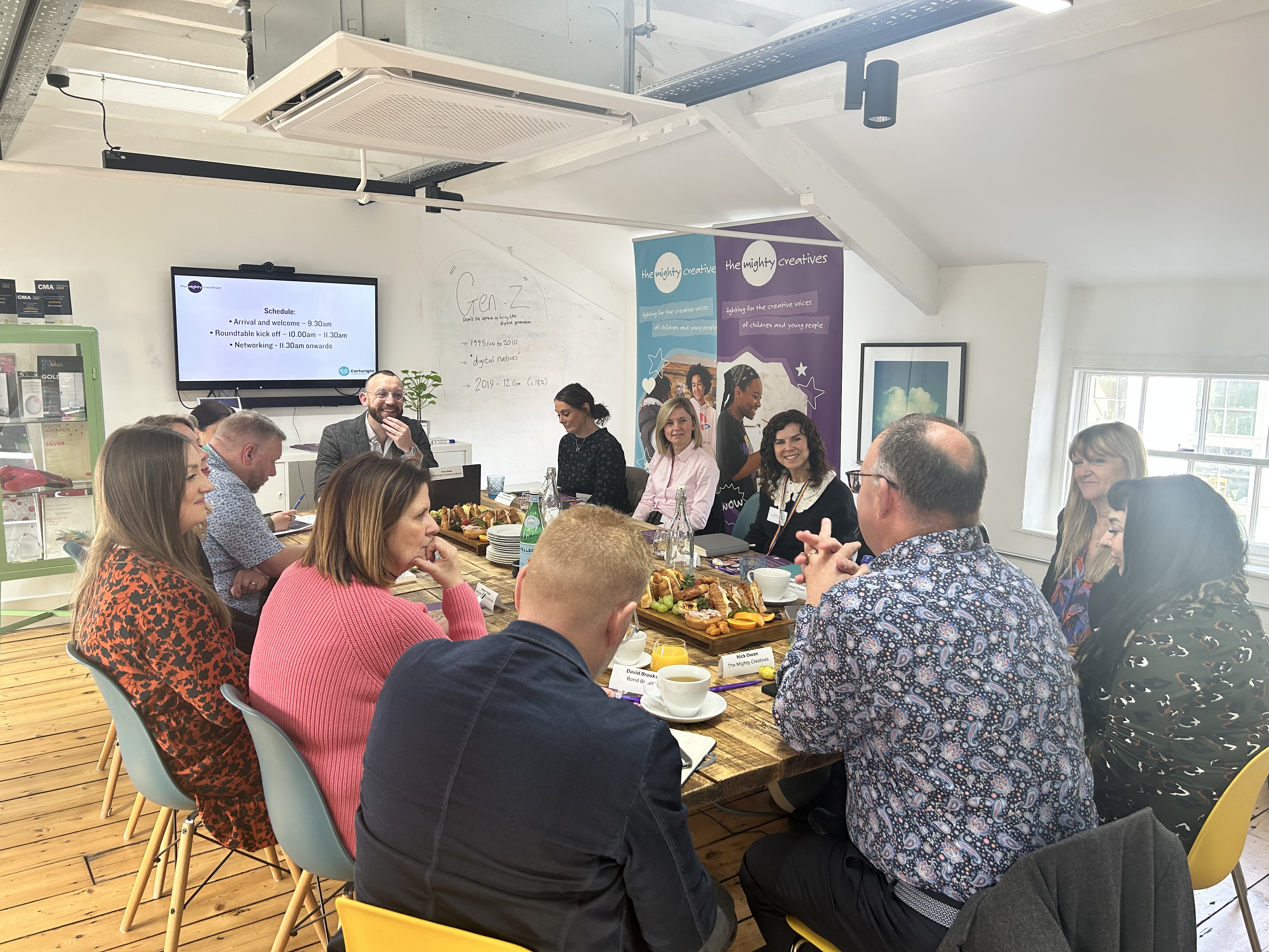 People sat around table networking