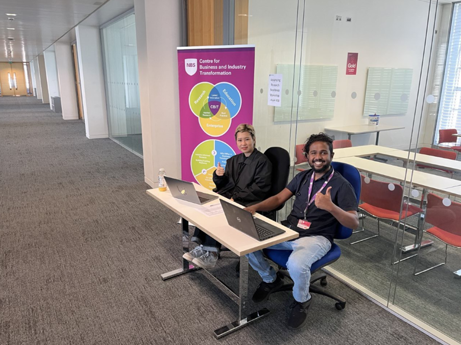 2 students sat at desks