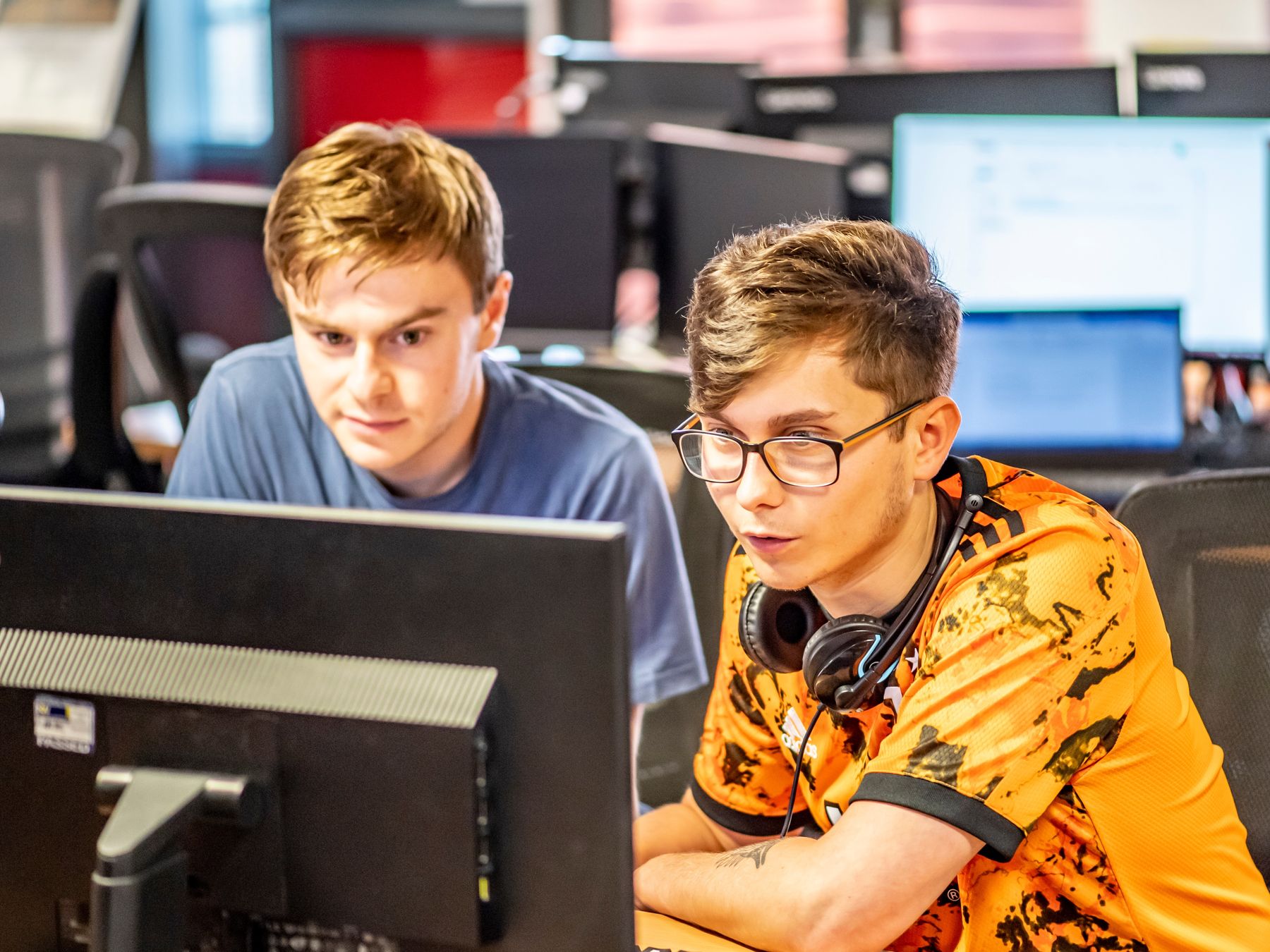 Two students looking at computer screen