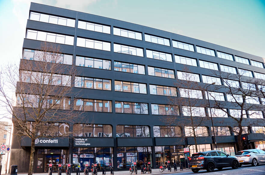 Exterior of the large seven-story London Campus building on Commercial Road in Whitechapel.