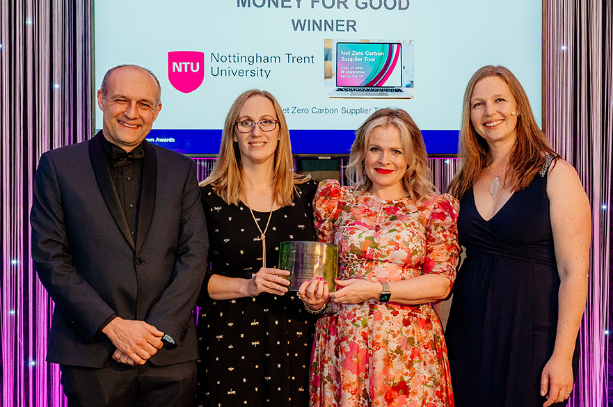 Staff members of NTU collecting the trophy in the Money is Good category at the Green Gown Awards