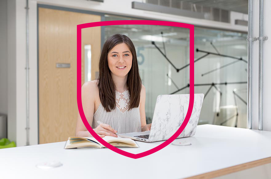 Fashion management student sat in workshop room