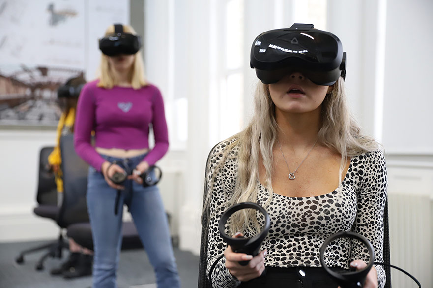 Students using VR headsets and controllers