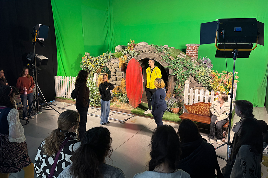 Students on set with a green screen
