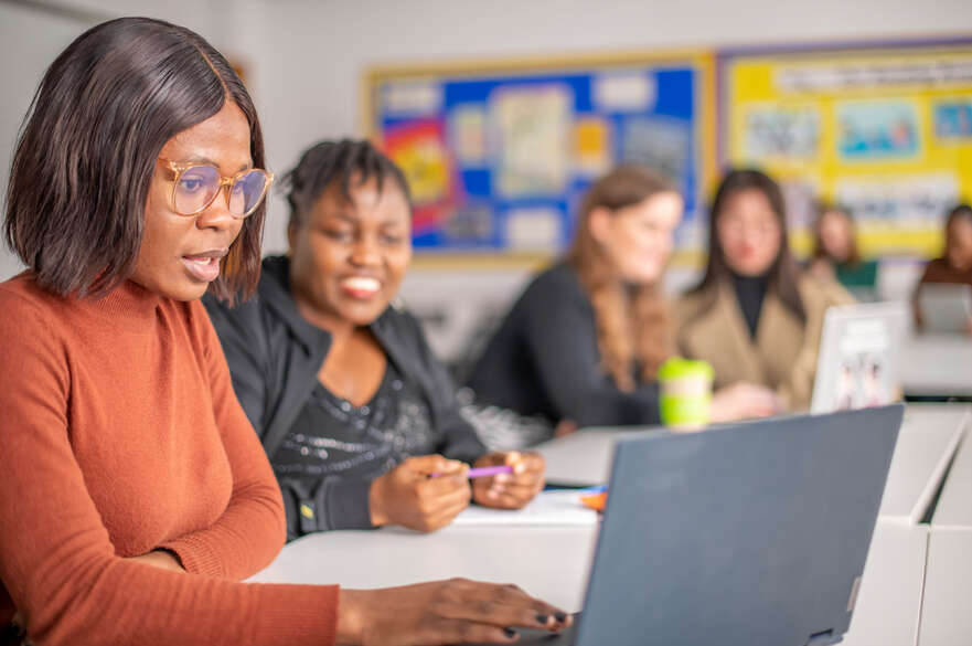 NIoE students on a laptop