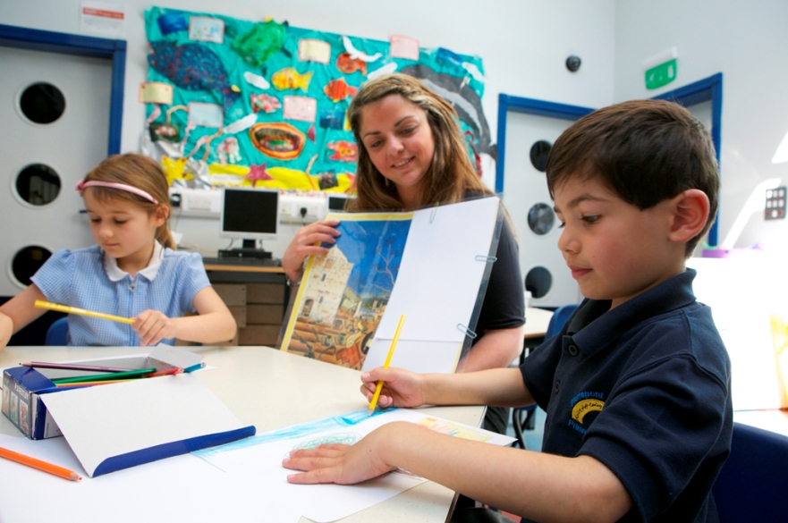 Teacher in primary school classroom
