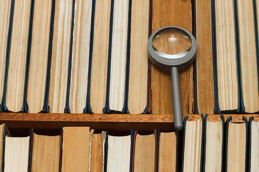 Magnifying glass on books