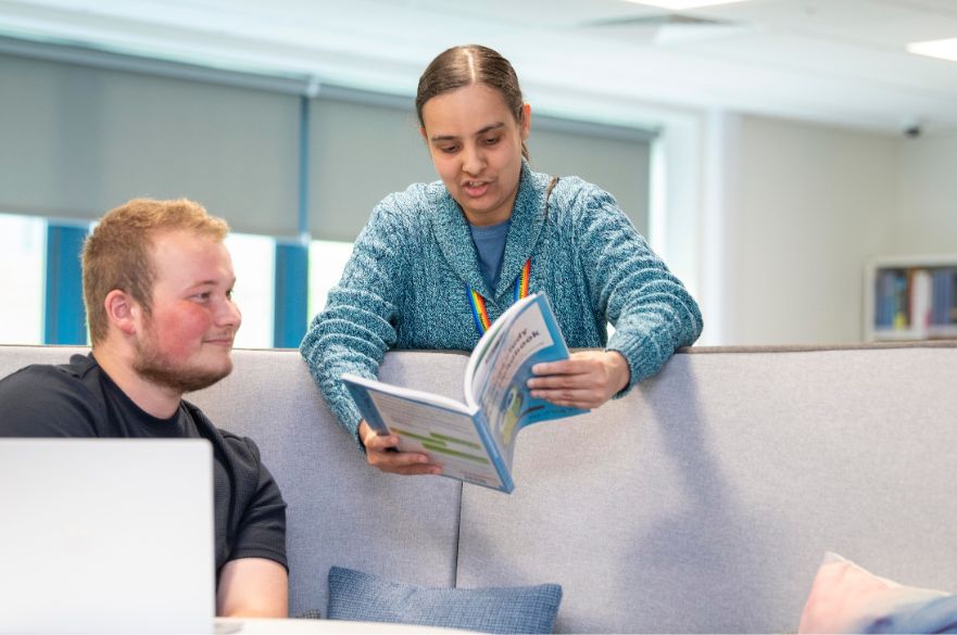 Student and staff member in NTU Mansfield library