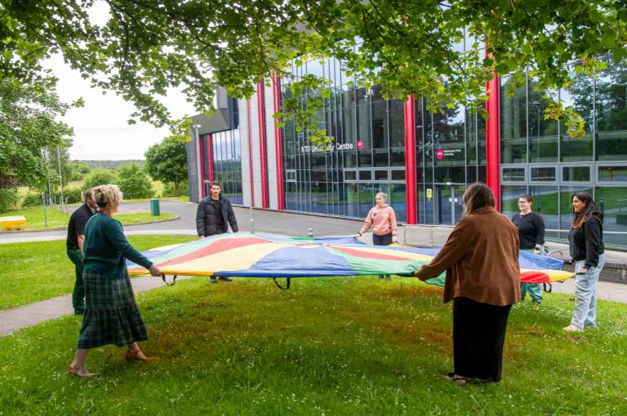 NTU Mansfield students outdoors with parachute