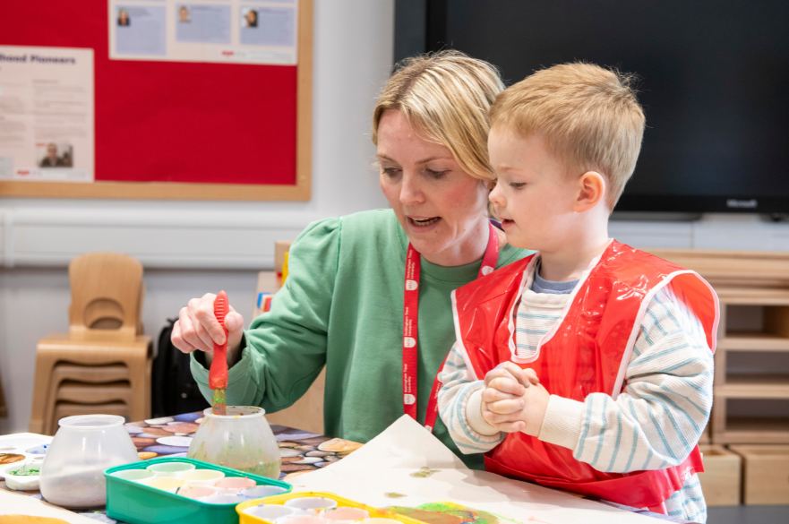 Young child and staff member in Early Childhood Simulation Suite