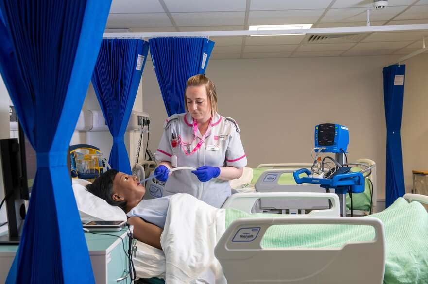 Nursing students on mock hospital ward