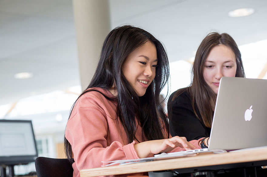 Students work on a laptop