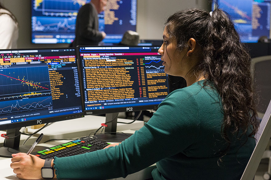 Student working on the Bloomberg terminals in the Nottingham Business School Business Lab on the City Campus at Nottingham Trent University