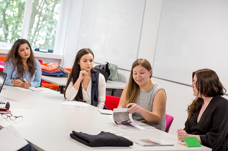 Students looking through a booklet
