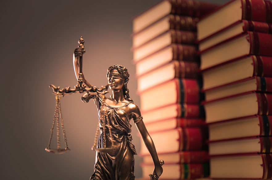 Law books and justice statue 