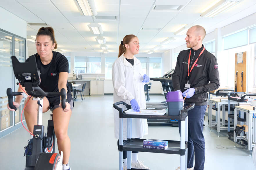 Student using sport science equipment in a lab