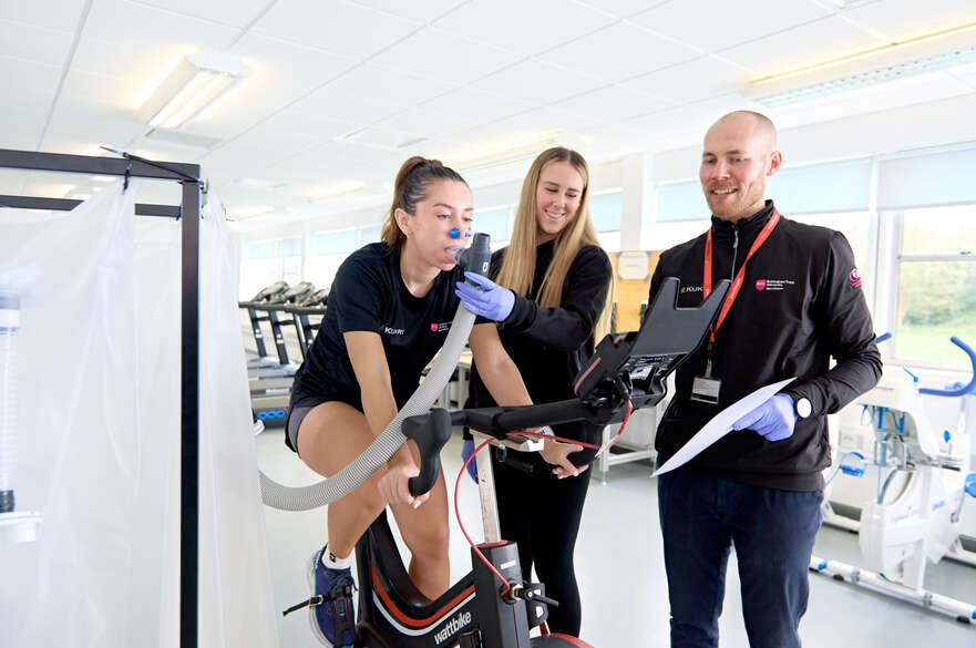 Student using sport science equipment in a lab