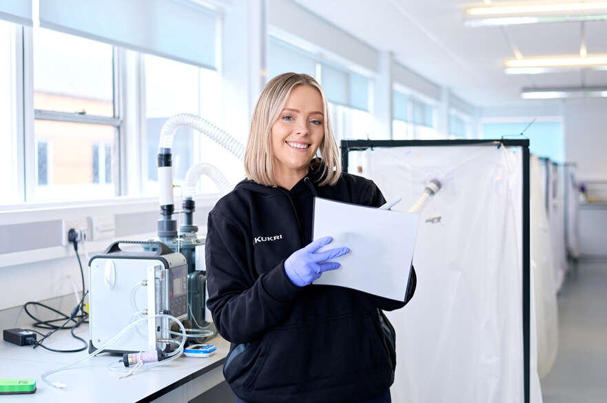 Student using physiology equipment in a lab
