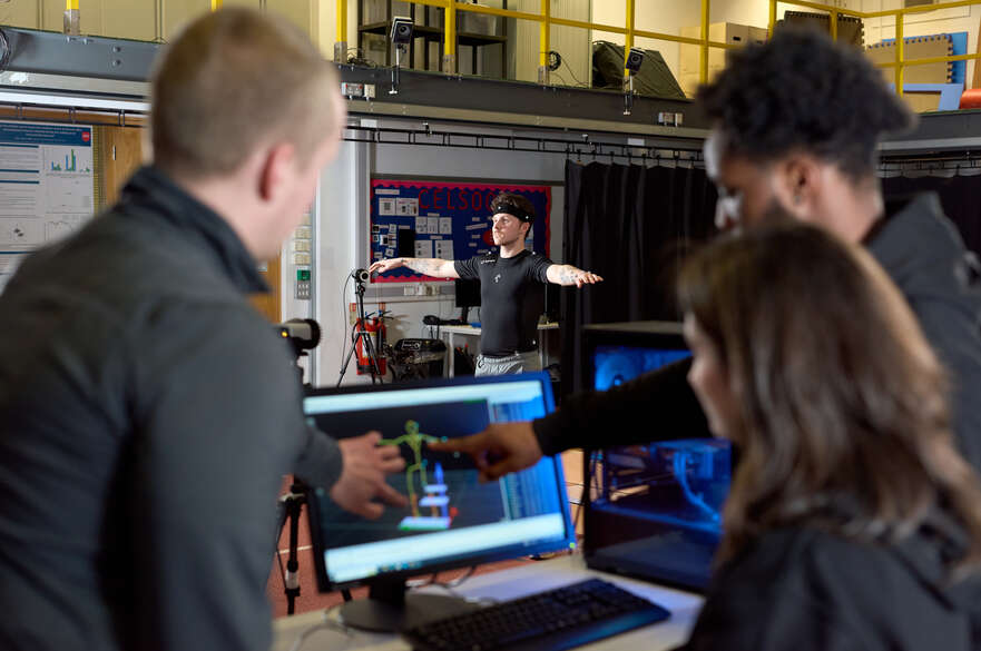 Student using biomechanics equipment in a lab