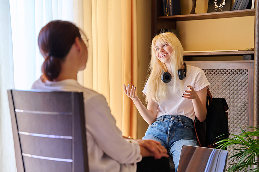 Two people in support meeting setting