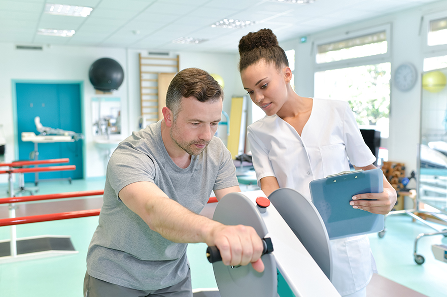 A patient being supported by an Occupational Therapist in a care setting