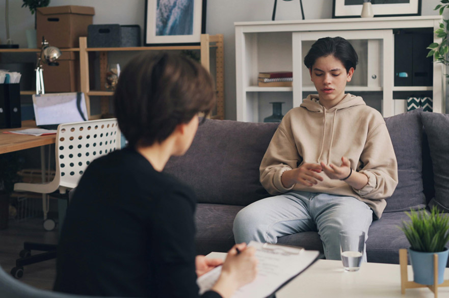 A youth worker talking to a young person