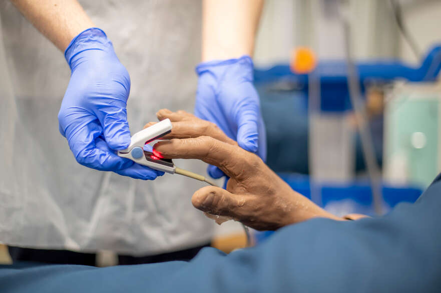 Acute Medicine header showing a student using equipment on a dummy