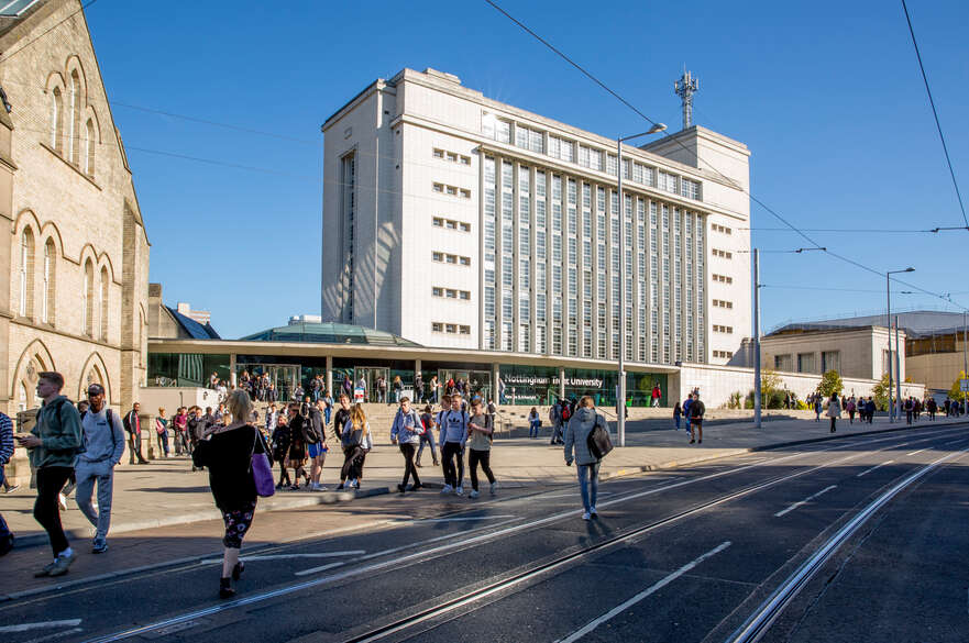 student walking outside of NTU Newton building