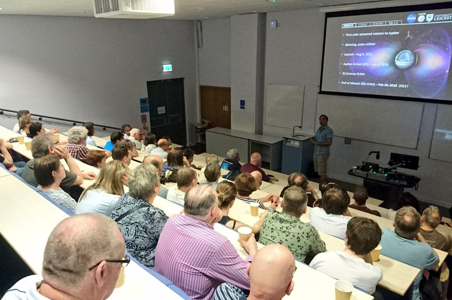 Audience listening to presentation about Jupiter